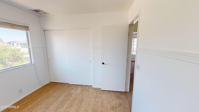 8541 W Pershing Ave, Peoria, AZ 85381 - unfurnished bedroom featuring light carpet and a closet