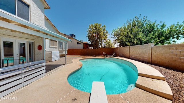 8541 W Pershing Ave, Peoria, AZ 85381 - view of swimming pool with a fenced backyard, a diving board, a patio, and french doors