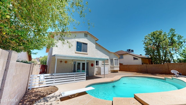 8541 W Pershing Ave, Peoria, AZ 85381 - view of swimming pool featuring french doors, a fenced backyard, a patio, and a diving board