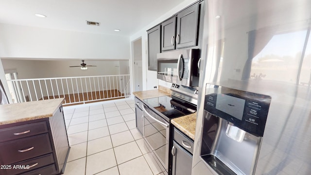 8541 W Pershing Ave, Peoria, AZ 85381 - kitchen with appliances with stainless steel finishes, a ceiling fan, and light tile patterned flooring