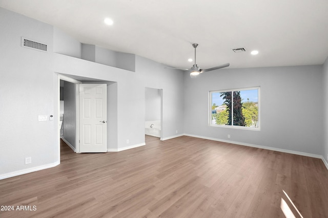 unfurnished room featuring hardwood / wood-style flooring, ceiling fan, and lofted ceiling