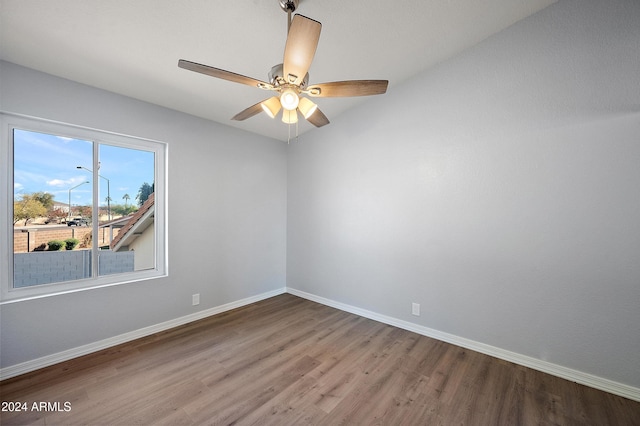 empty room featuring wood-type flooring and ceiling fan