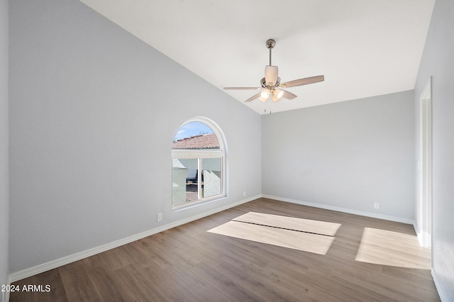 unfurnished room featuring wood-type flooring, ceiling fan, and lofted ceiling