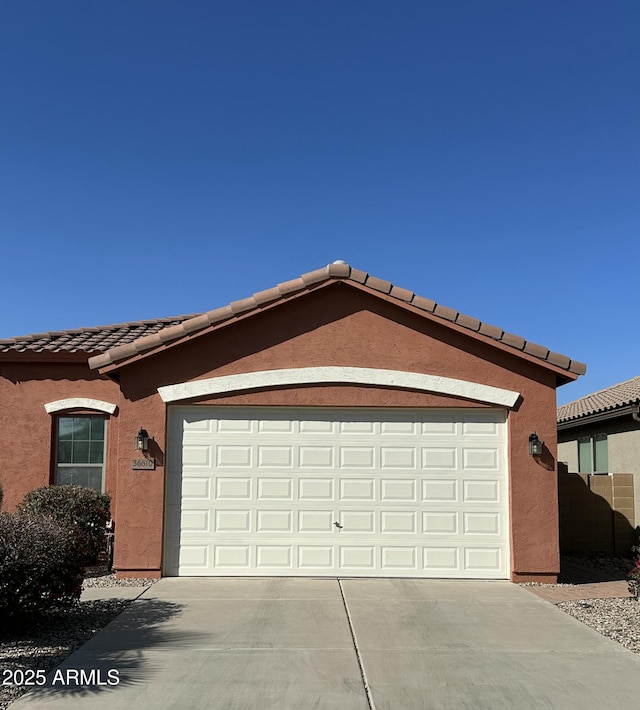 exterior space featuring concrete driveway