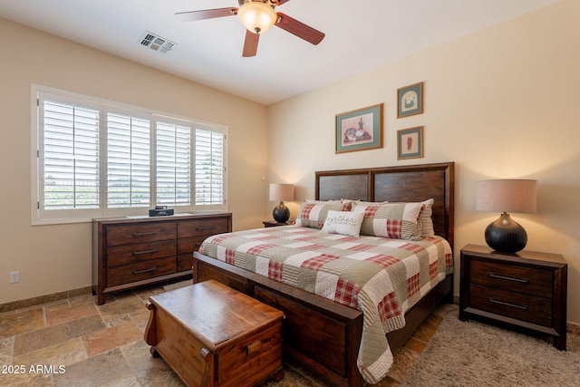 6931 S Four Peaks Way, Chandler, AZ 85249 - bedroom with stone tile flooring and ceiling fan