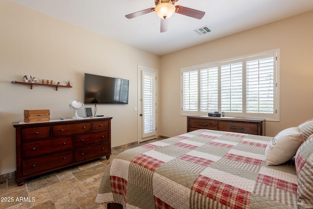 6931 S Four Peaks Way, Chandler, AZ 85249 - bedroom featuring access to exterior, light stone finish flooring, and a ceiling fan
