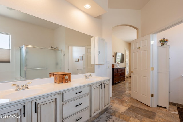 6931 S Four Peaks Way, Chandler, AZ 85249 - bathroom featuring stone tile flooring, double vanity, and a shower stall
