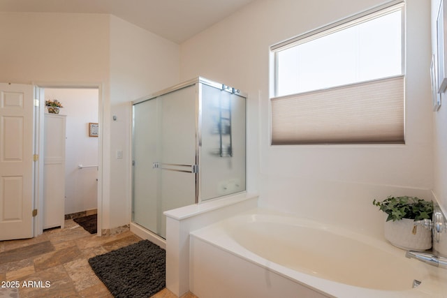 6931 S Four Peaks Way, Chandler, AZ 85249 - bathroom with a bath, a shower stall, and stone finish flooring