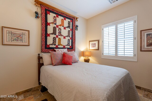 6931 S Four Peaks Way, Chandler, AZ 85249 - bedroom with stone tile floors and baseboards