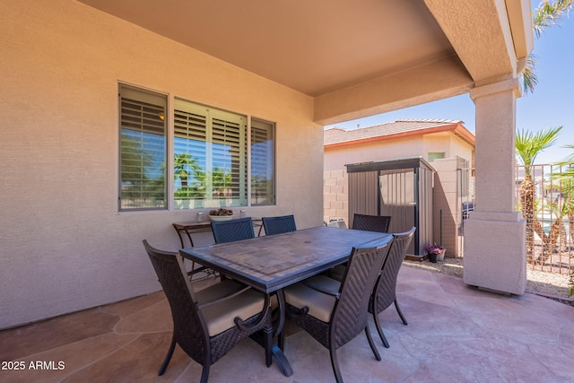 6931 S Four Peaks Way, Chandler, AZ 85249 - view of patio / terrace featuring a storage unit and outdoor dining area