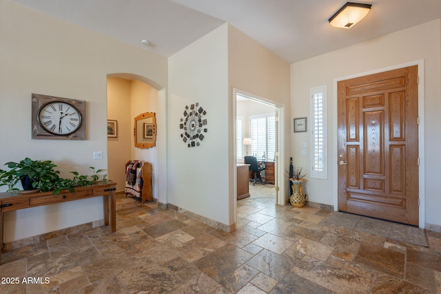 6931 S Four Peaks Way, Chandler, AZ 85249 - foyer entrance with stone tile flooring and arched walkways
