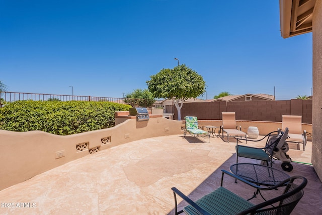 6931 S Four Peaks Way, Chandler, AZ 85249 - view of patio with exterior kitchen