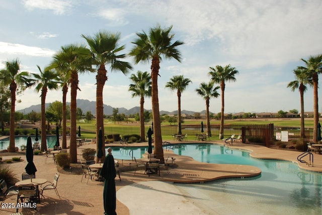 6931 S Four Peaks Way, Chandler, AZ 85249 - community pool with a mountain view and a patio area