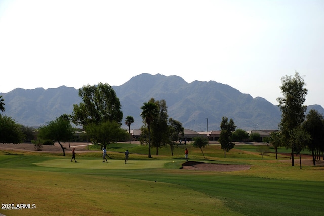 6931 S Four Peaks Way, Chandler, AZ 85249 - view of community with a lawn, a mountain view, and view of golf course