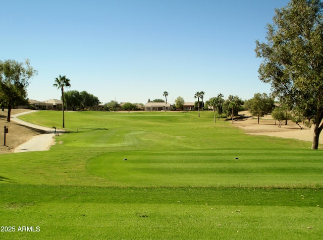 6931 S Four Peaks Way, Chandler, AZ 85249 - surrounding community with golf course view and a lawn