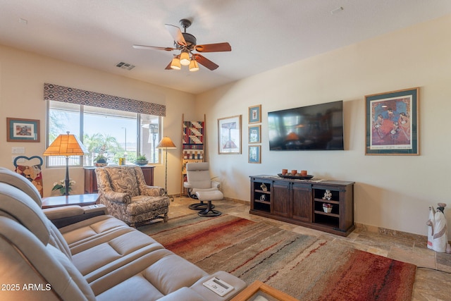 6931 S Four Peaks Way, Chandler, AZ 85249 - living room with ceiling fan and stone tile flooring