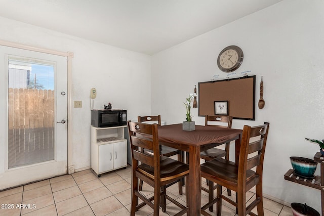 dining area with light tile patterned flooring