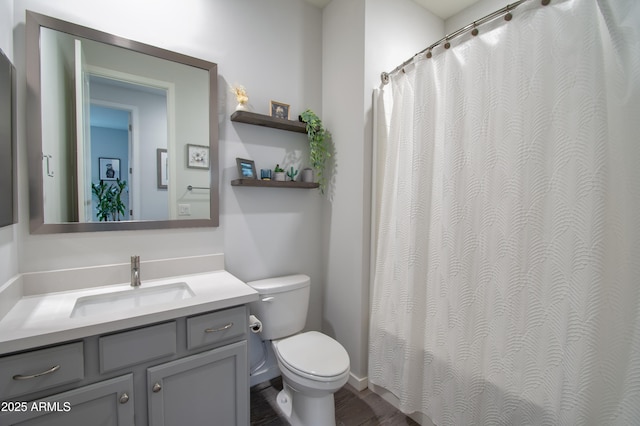 bathroom featuring vanity and toilet