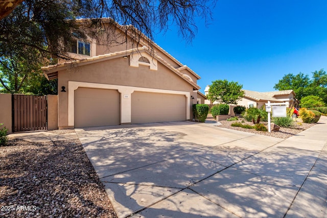 3581 W Ironwood Dr, Chandler, AZ 85226 - view of front facade with driveway, stucco siding, an attached garage, a gate, and a tile roof