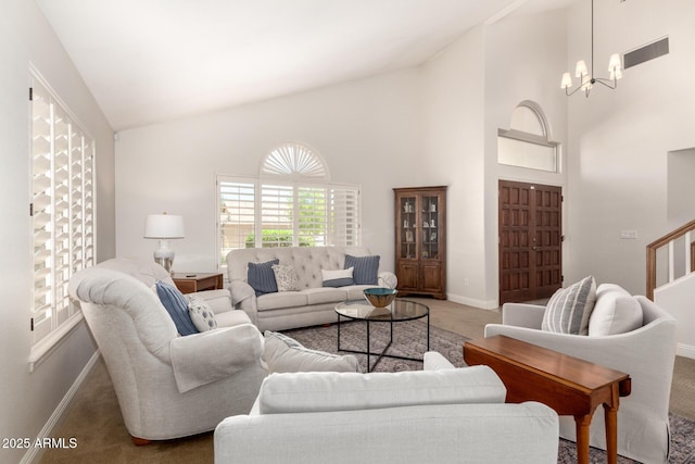 3581 W Ironwood Dr, Chandler, AZ 85226 - carpeted living area featuring baseboards, high vaulted ceiling, a chandelier, and stairway
