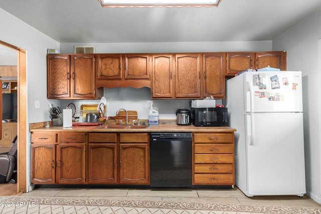 kitchen featuring black appliances and sink