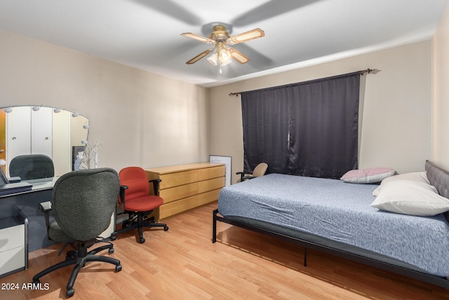 bedroom with light wood-type flooring and ceiling fan