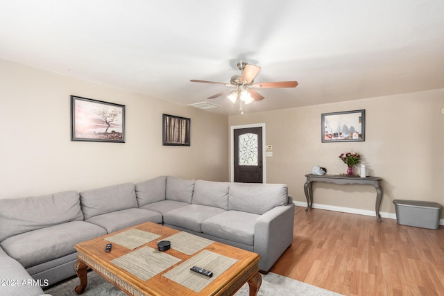 living room featuring ceiling fan and light wood-type flooring