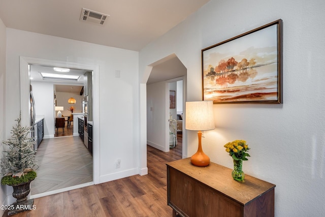 hall featuring dark wood-type flooring