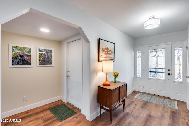 foyer entrance with hardwood / wood-style flooring