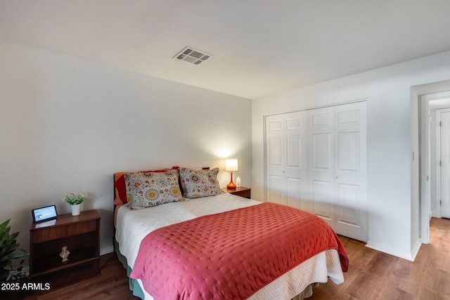 bedroom featuring a closet and wood-type flooring