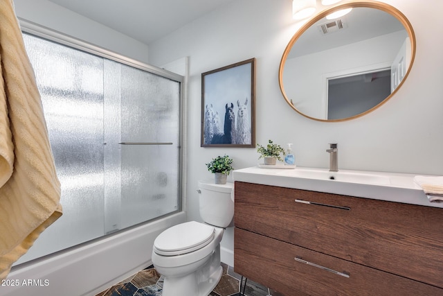 full bathroom with toilet, combined bath / shower with glass door, and vanity