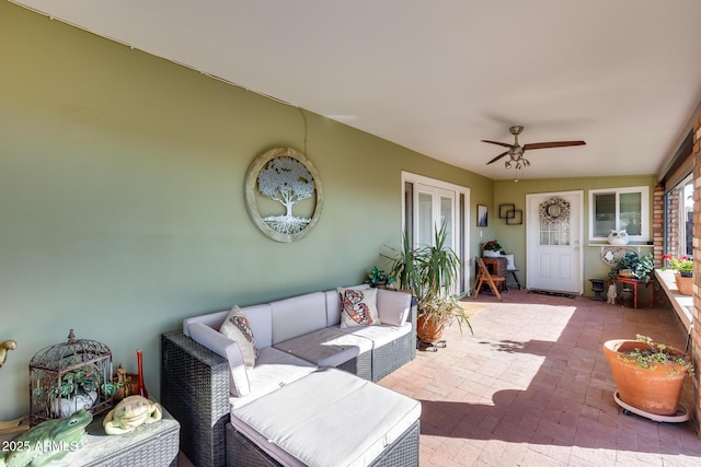 view of patio / terrace with ceiling fan and an outdoor living space