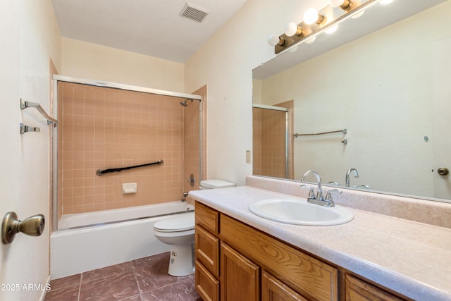 full bath featuring visible vents, toilet, vanity, and washtub / shower combination