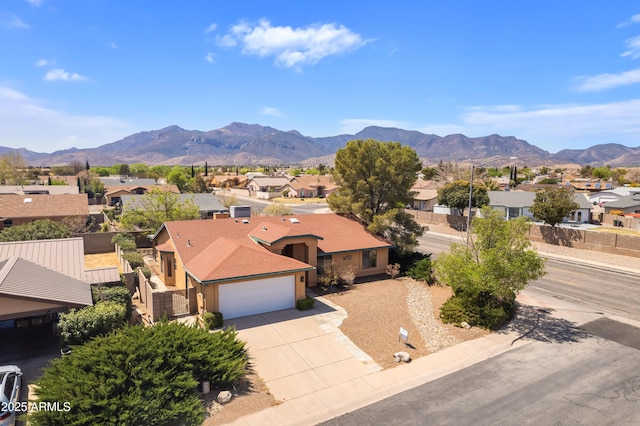 exterior space with a mountain view and a residential view