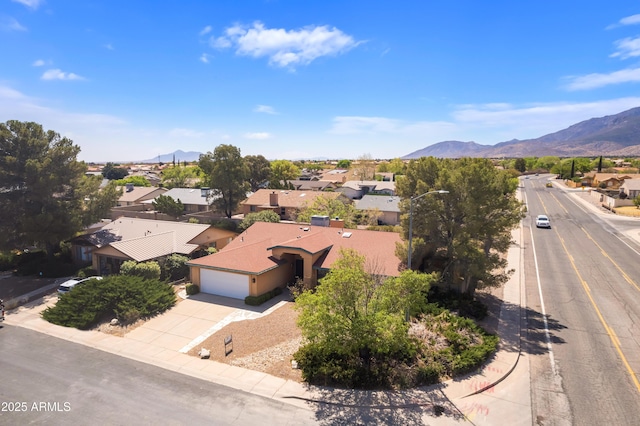 aerial view with a mountain view and a residential view