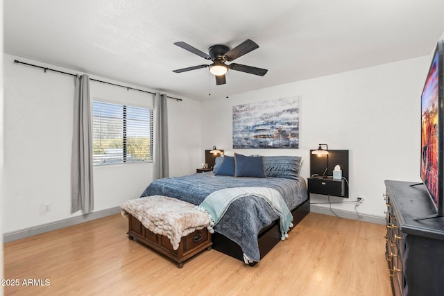 bedroom featuring ceiling fan and light hardwood / wood-style floors