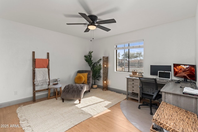 office space with ceiling fan and light hardwood / wood-style floors