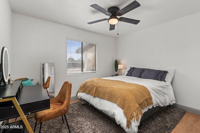 bedroom with hardwood / wood-style flooring and ceiling fan