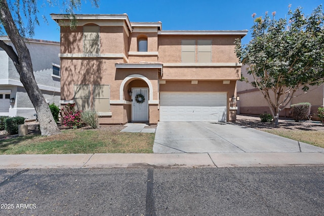 view of front of house with a garage, stucco siding, and concrete driveway