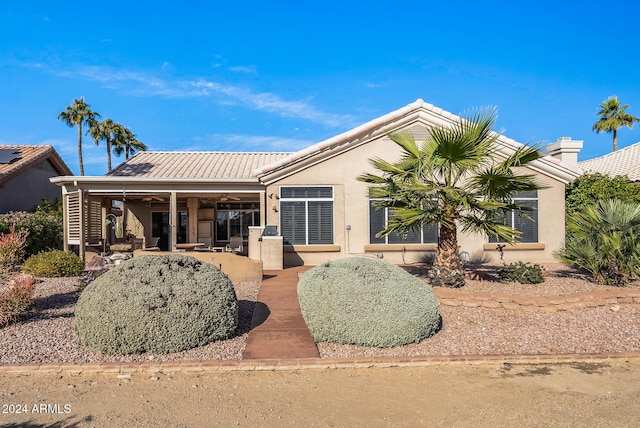 ranch-style house with a patio and stucco siding