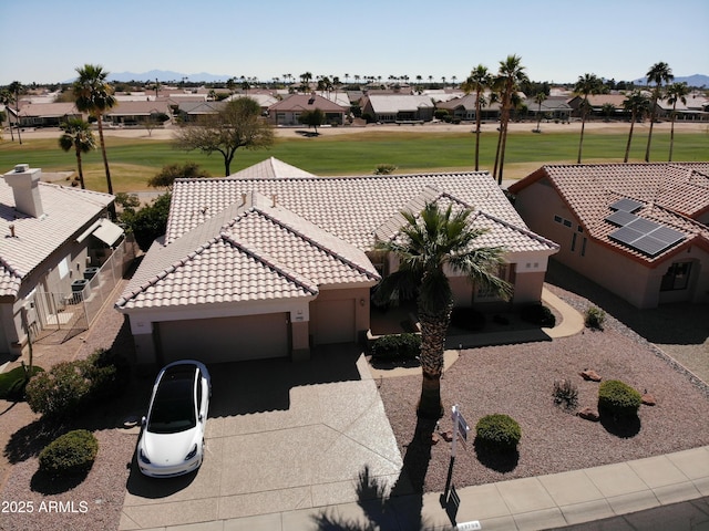 birds eye view of property with a residential view