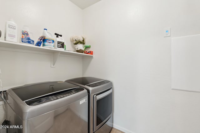 laundry area with independent washer and dryer