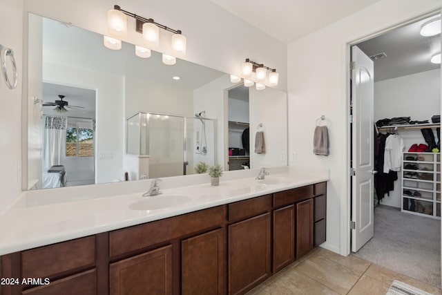 bathroom featuring vanity, an enclosed shower, ceiling fan, and tile patterned floors