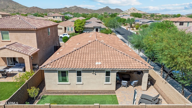 birds eye view of property with a mountain view