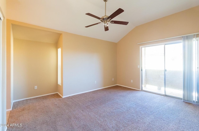 empty room with ceiling fan, light colored carpet, and vaulted ceiling