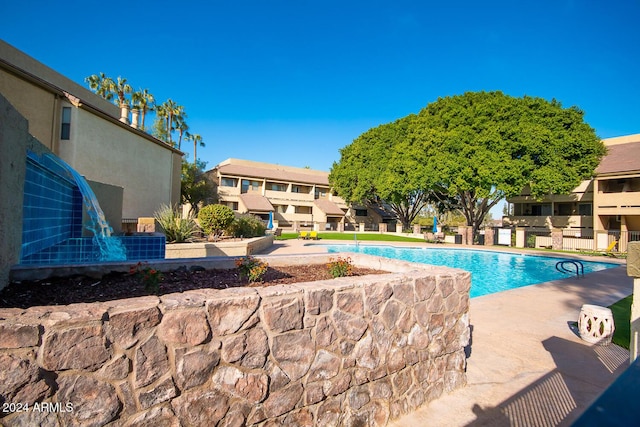 view of swimming pool featuring a patio area