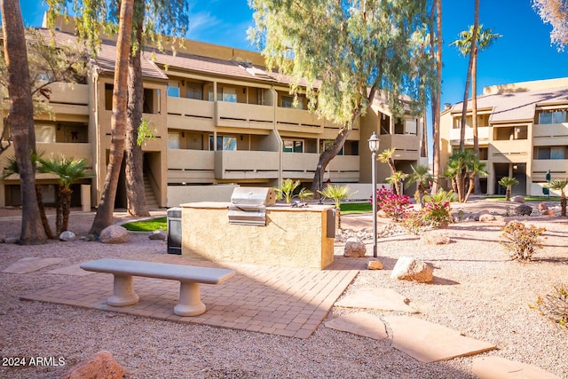 view of community featuring exterior kitchen