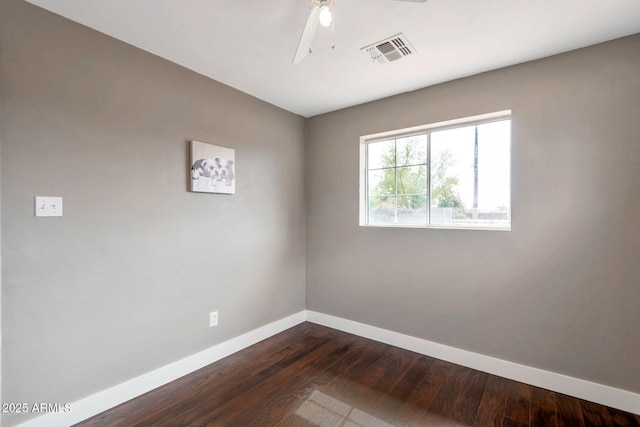 4427 W Crittenden Ln, Phoenix, AZ 85031 - empty room featuring baseboards, dark wood finished floors, and ceiling fan