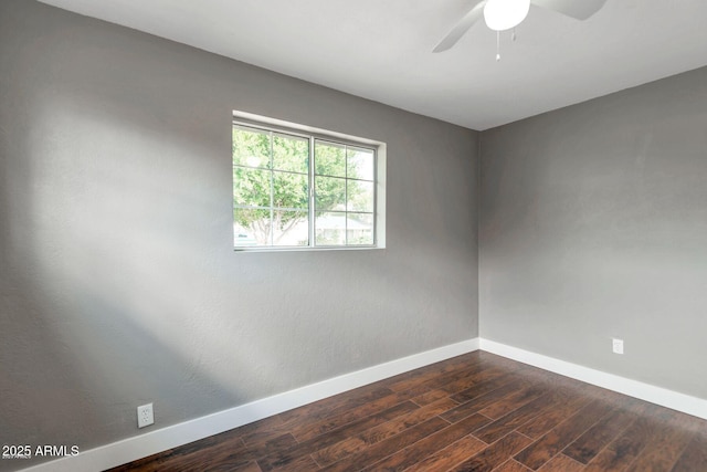 4427 W Crittenden Ln, Phoenix, AZ 85031 - empty room with baseboards, ceiling fan, and dark wood-style floors