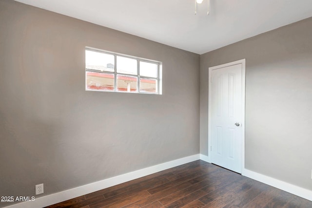 4427 W Crittenden Ln, Phoenix, AZ 85031 - empty room with baseboards and dark wood-style floors
